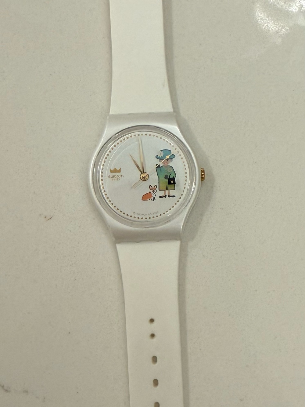 Swatch White Silicone Watch with Playful Lady and Dog Dial hat color changes